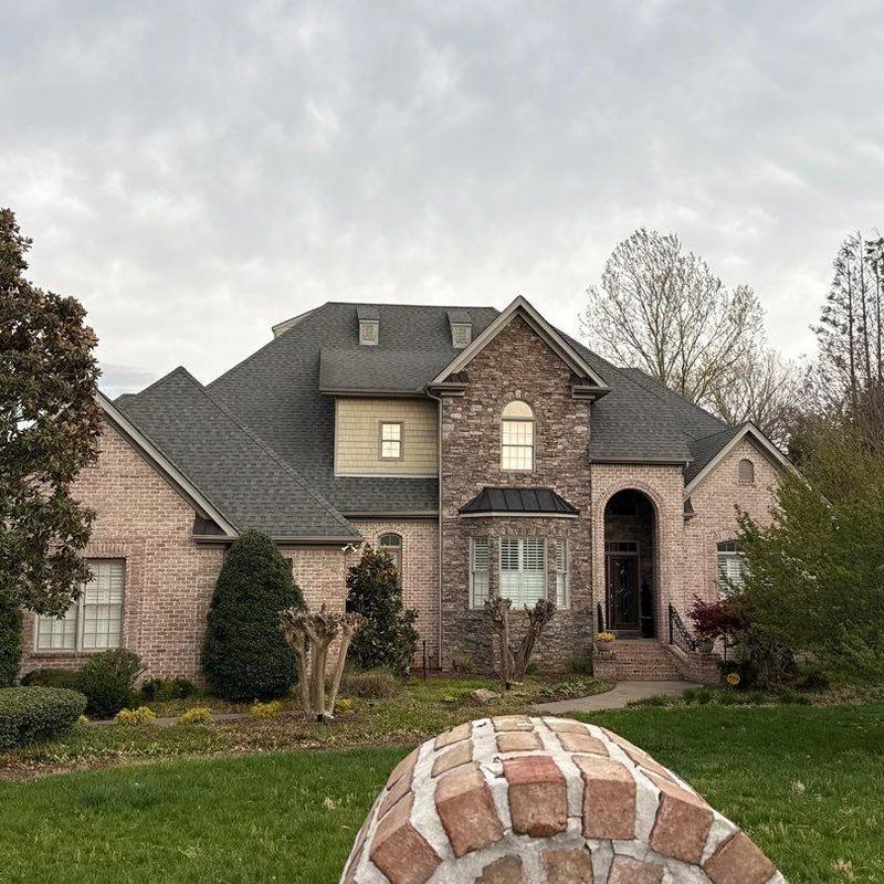 Asphalt shingle roof with hail damage inspection