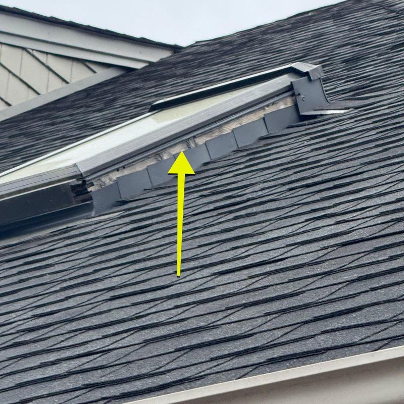 Asphalt shingle roof with flashing seal damage
