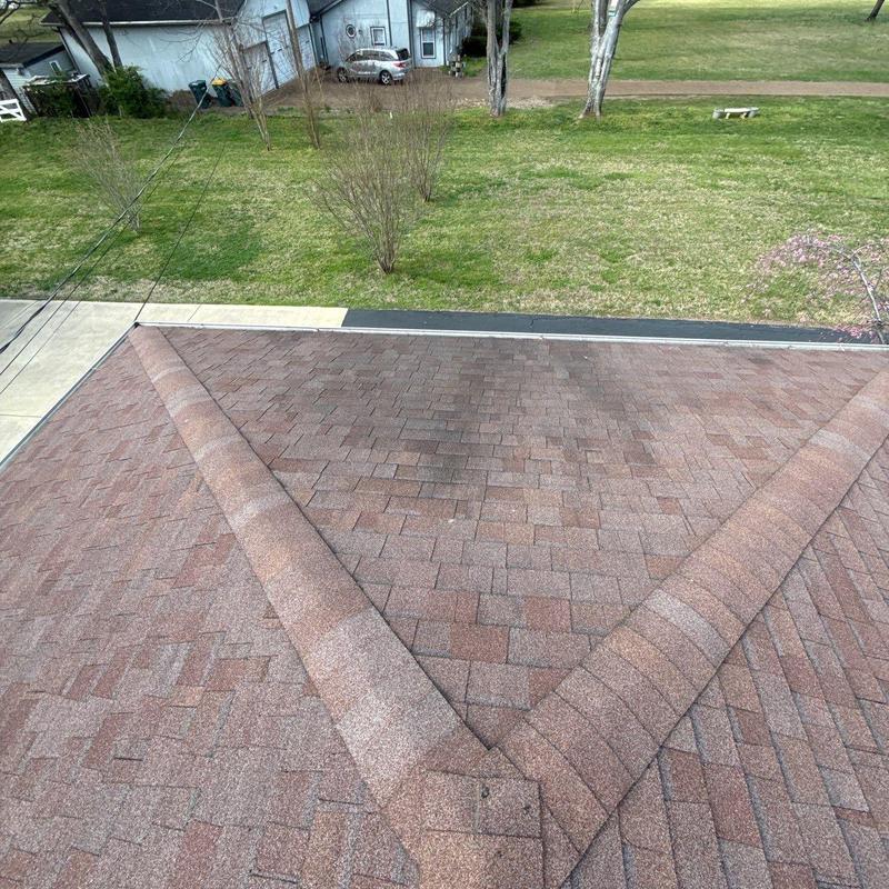 Asphalt shingle roof with ridge cap and ventilation inspection