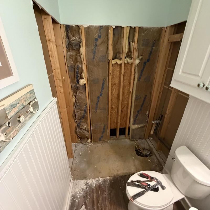 Shower area with exposed studs and insulation removed Shower area with exposed studs and insulation removed