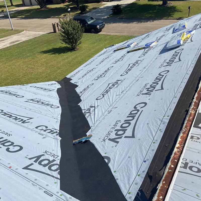 Synthetic underlayment installation on residential roof