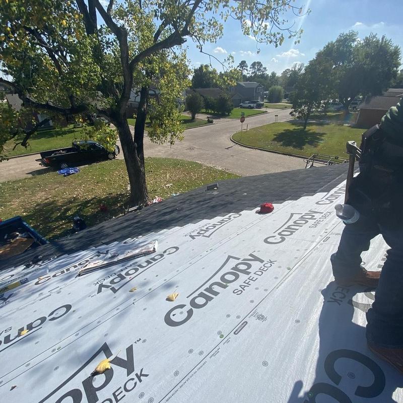 Synthetic underlayment installation on residential roof
