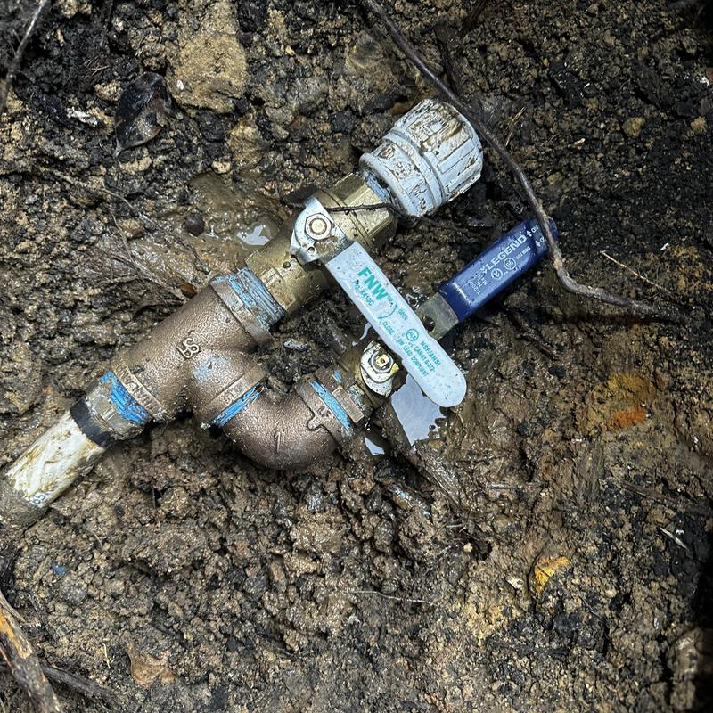 Whole house shutoff manifold valve in soil dirt