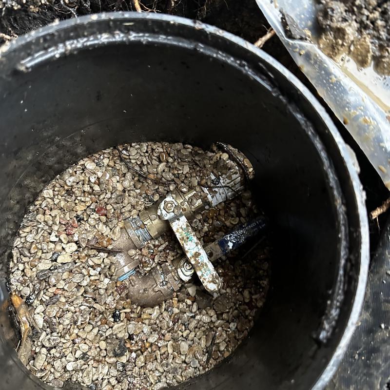 Whole house shutoff manifold in gravel pit