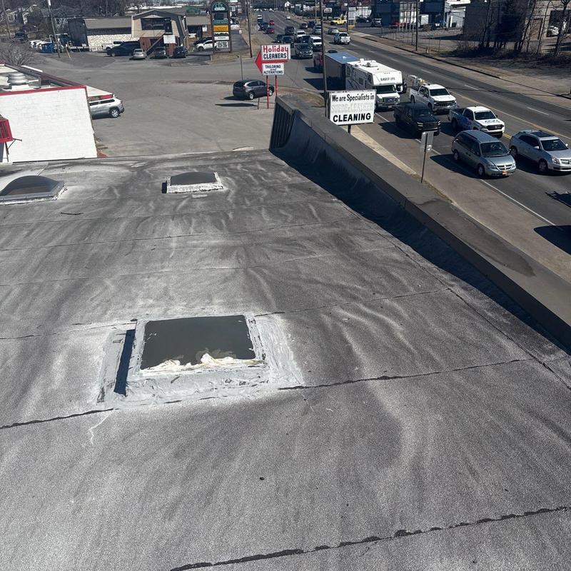 Modified bitumen flat roof with sealed patches
