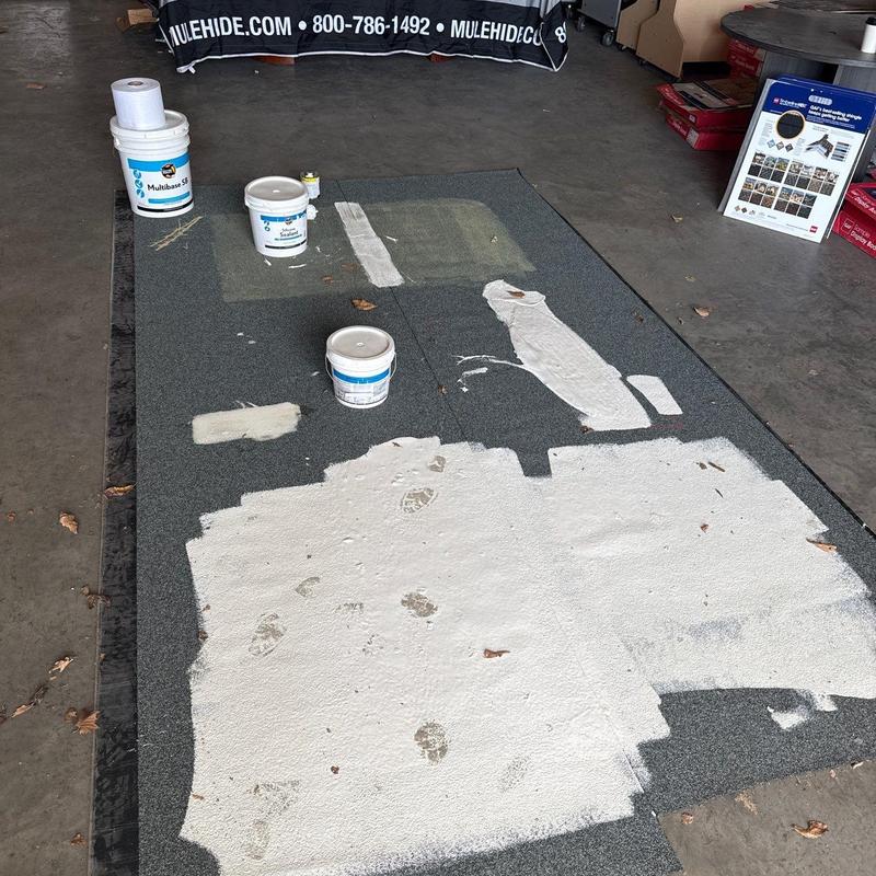 Modified bitumen flat roof with sealant and patches