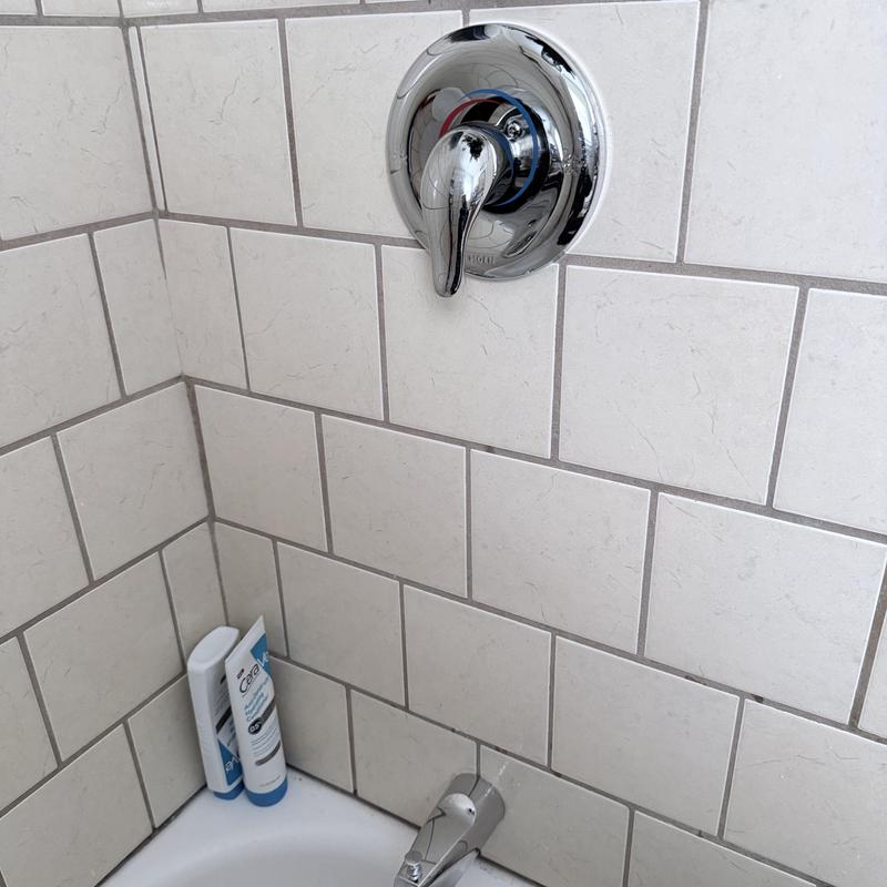 Shower valve and tub spout with tiled wall