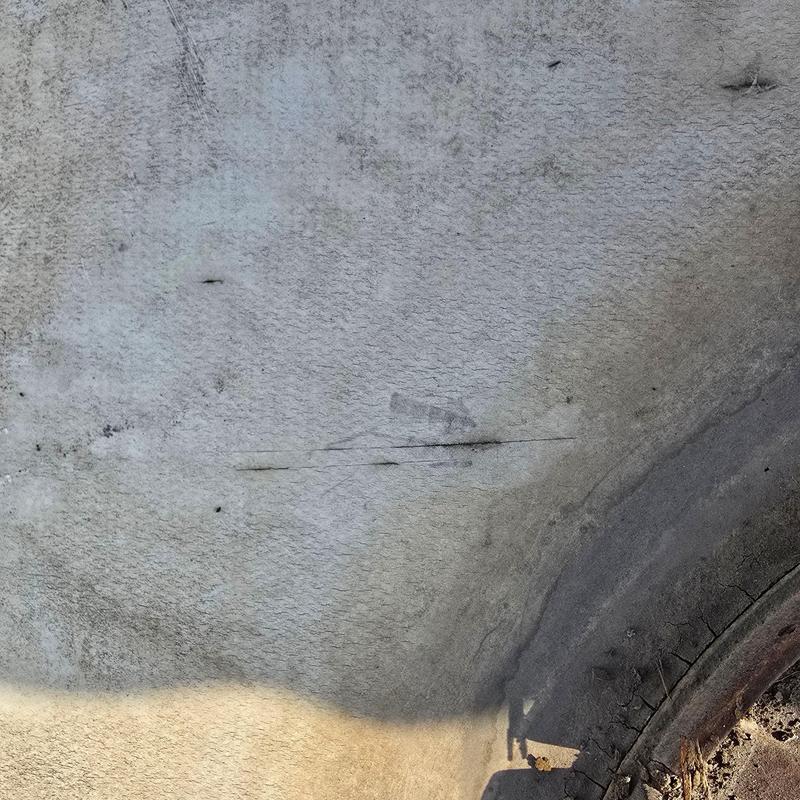 TPO flat roof with cracks and seam damage TPO flat roof with cracks and seam damage