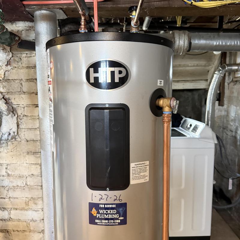 Water heater installation with copper piping in basement