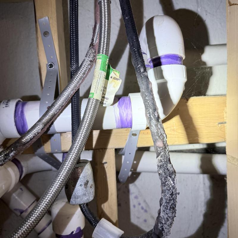 Kitchen faucet water supply lines with corrosion buildup