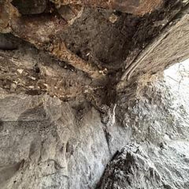 Drain system tunneling under slab with rods and hangers