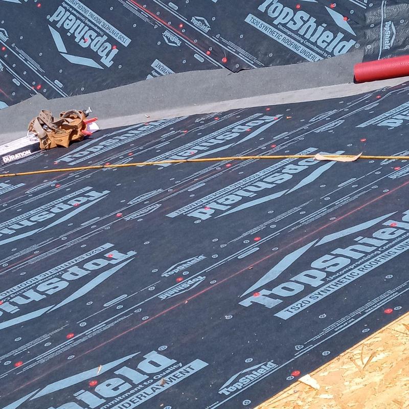 Synthetic roofing underlayment with TopShield branding Synthetic roofing underlayment with TopShield branding