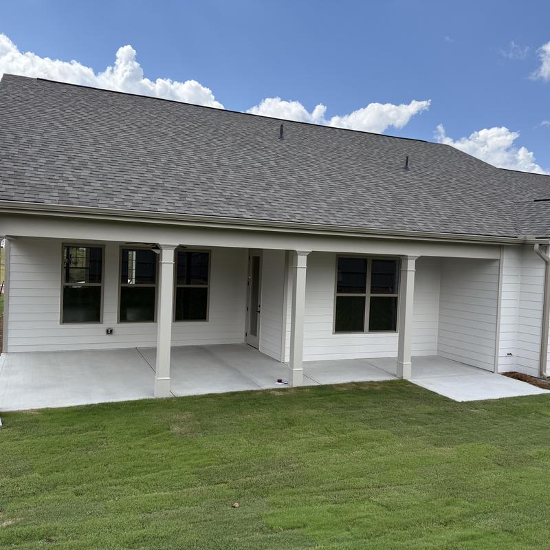 Exterior concrete porch and deck with supporting columns
