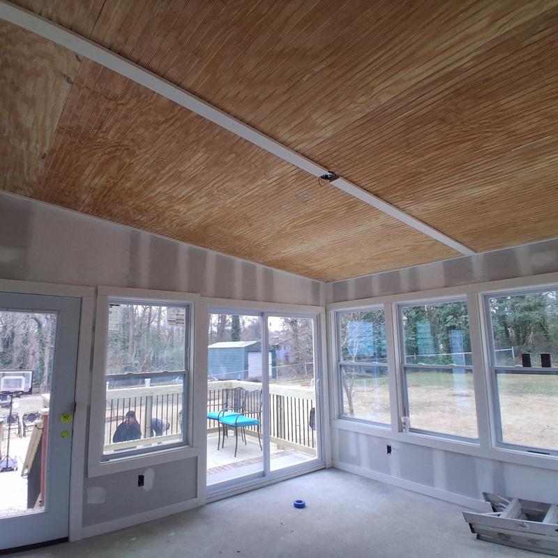 Patio enclosure windows and wood ceiling installation