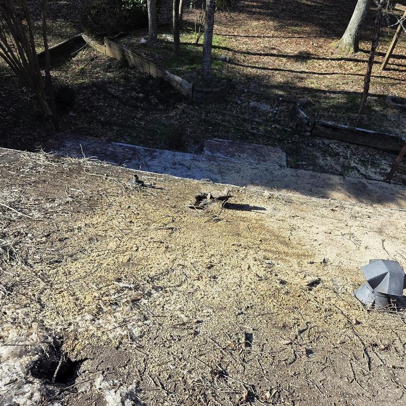 Roof deck with debris and damaged pipe boot