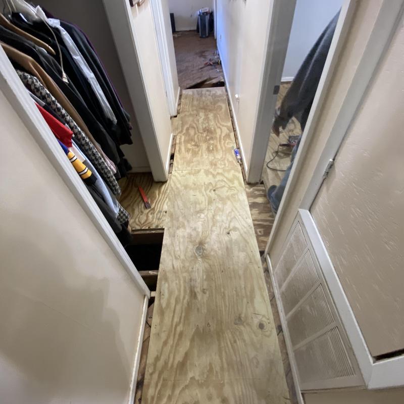 Subfloor plywood installation in hallway corridor Subfloor plywood installation in hallway corridor