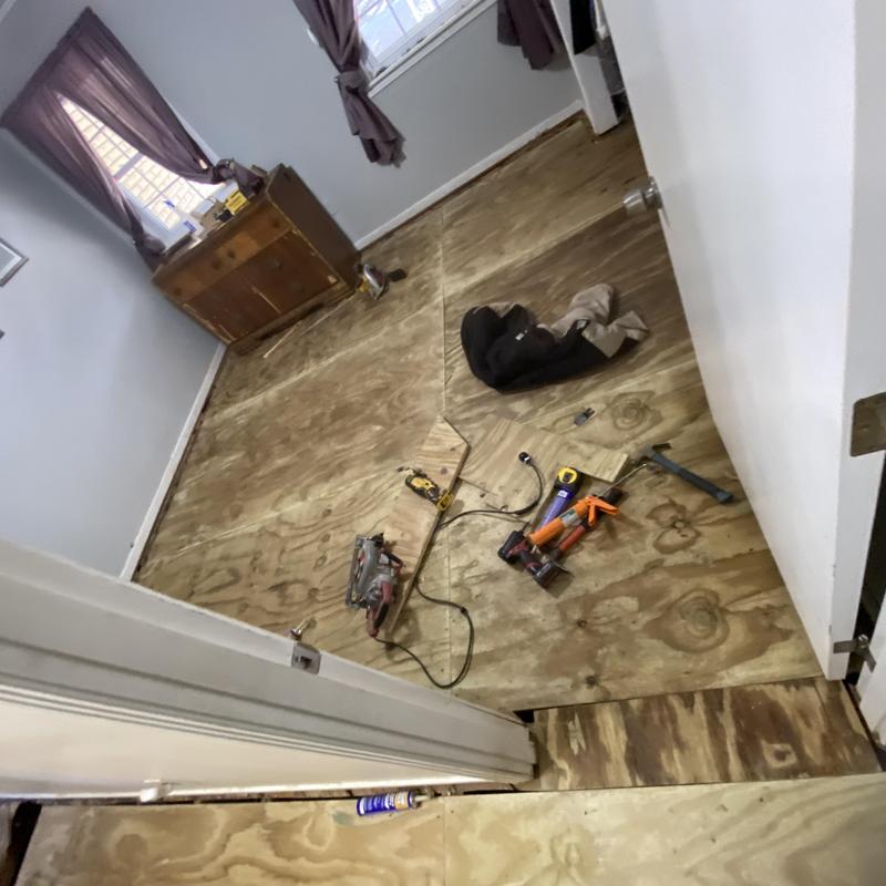 Subfloor plywood installation with tools in bedroom Subfloor plywood installation with tools in bedroom
