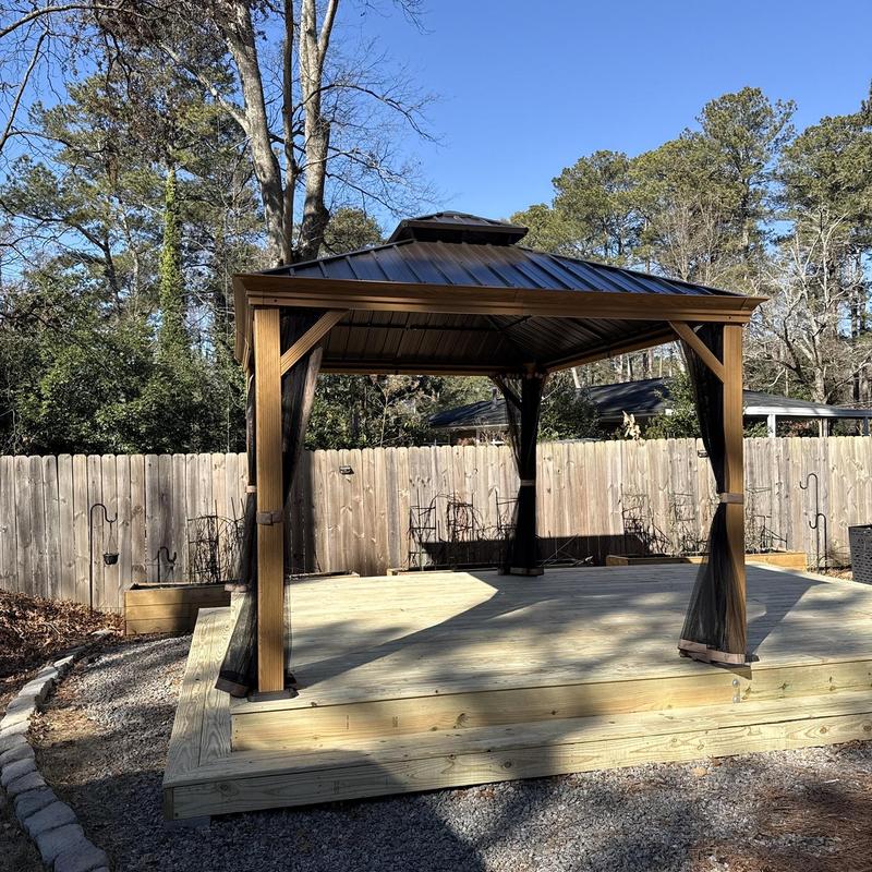 Exterior wood deck with metal roof gazebo