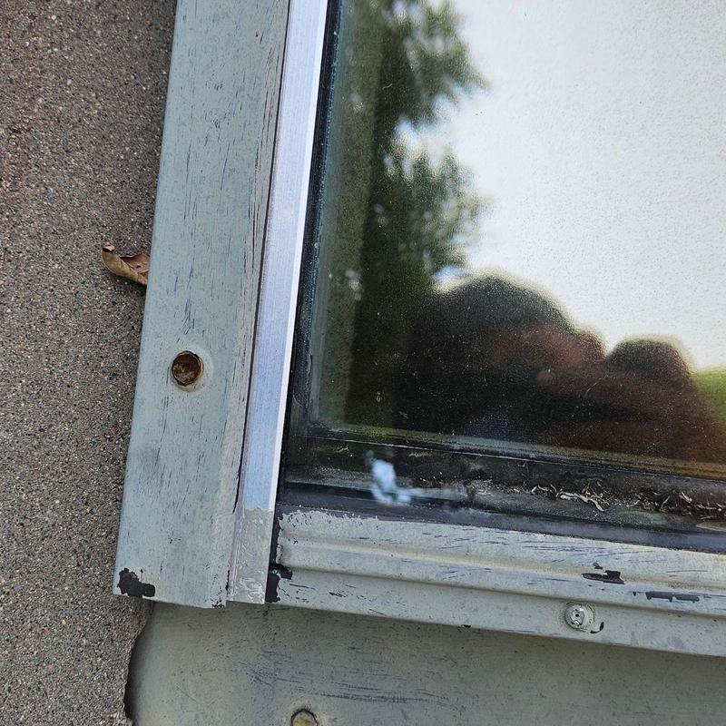 Skylight flashing and sealant detail on roof Skylight flashing and sealant detail on roof