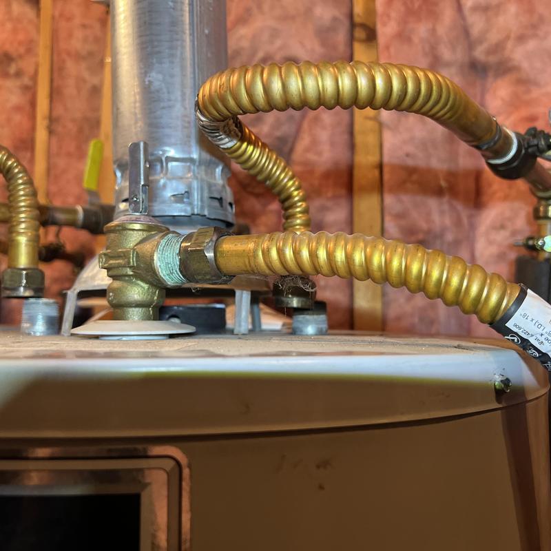 Flexible gas lines on water heater in utility area