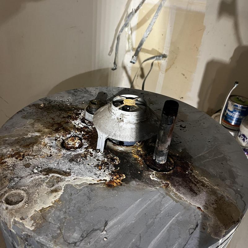Water heater top rust and corrosion damage close-up