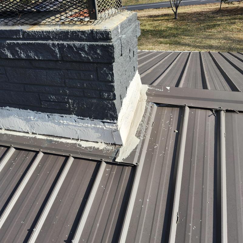 Metal roof chimney flashing with sealant application
