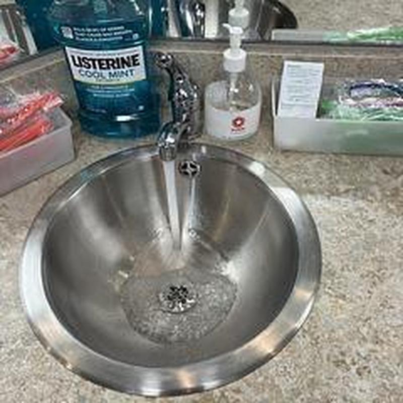 Brushing station stainless steel sink with running water