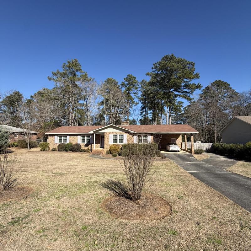 Asphalt shingle roof on single-story brick house