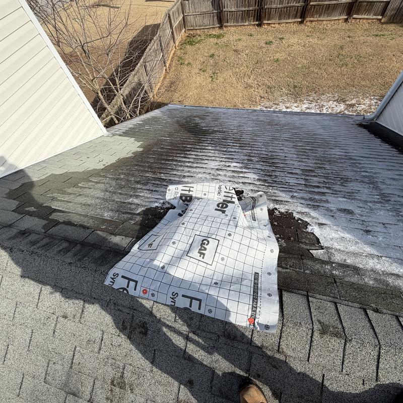 Box vent on roof covered with tarp after leak detected