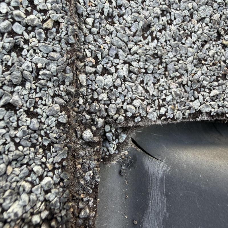 Box vent crack on shingle roof close-up detail