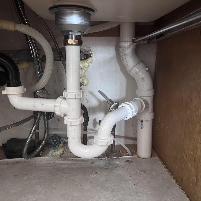 PVC kitchen sink drain with new tubular P trap installation