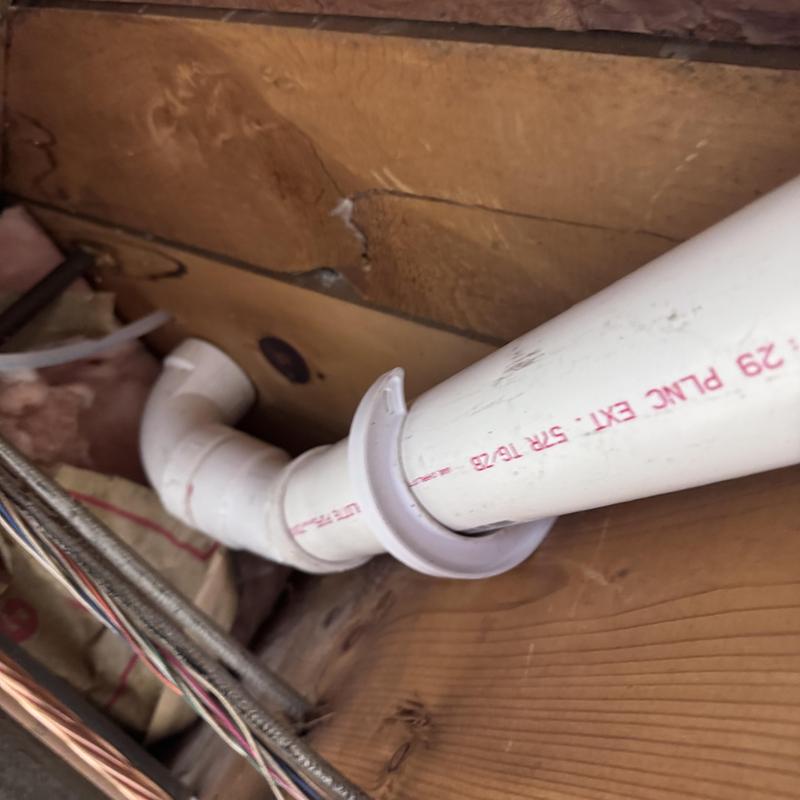 2-inch PVC kitchen drain pipe with elbow fitting installation