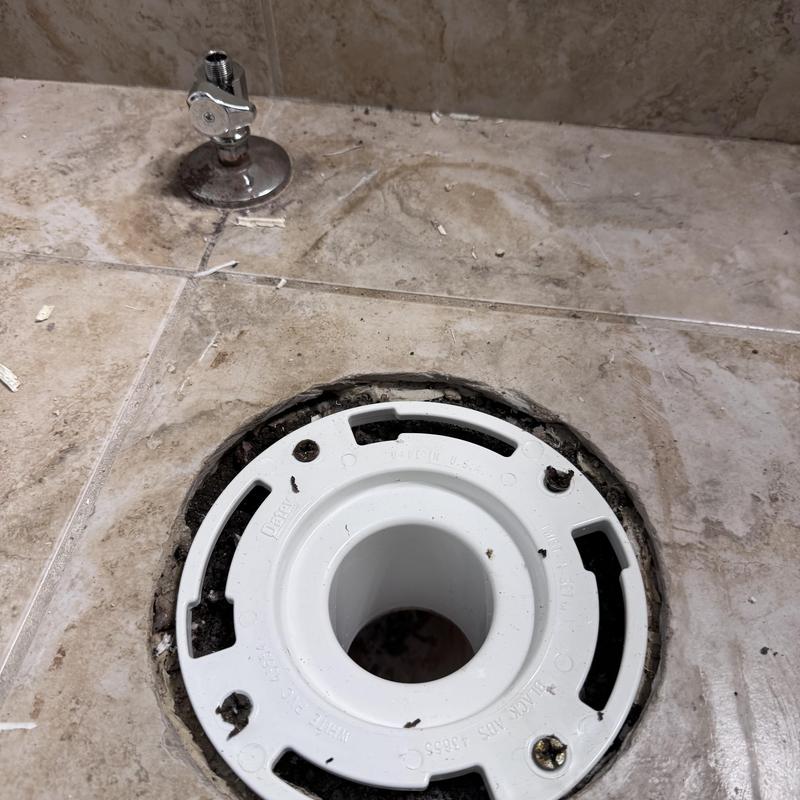 Toilet flange replacement on tile floor with valve nearby