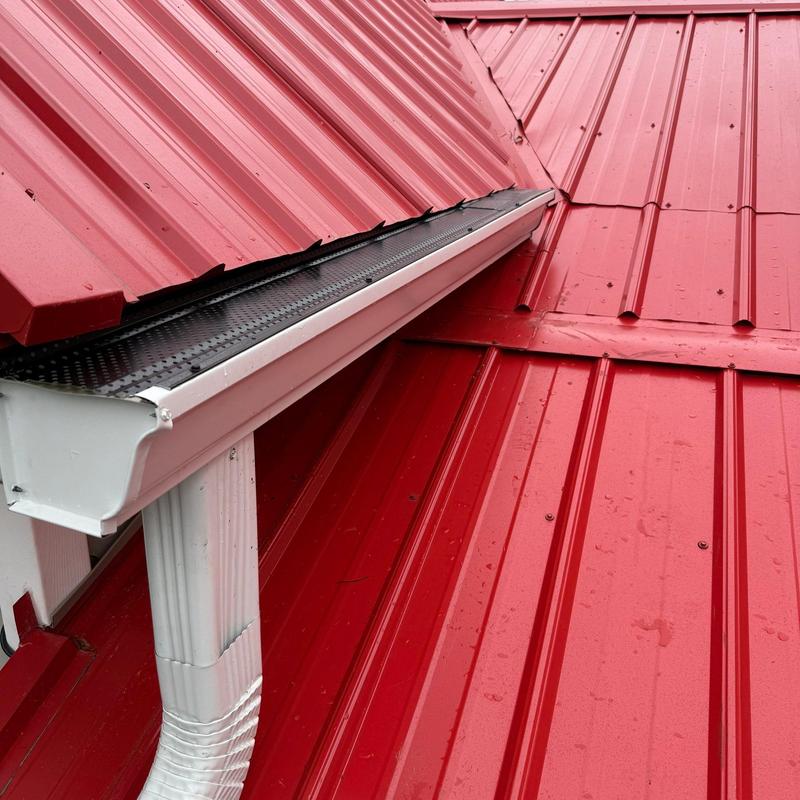 Metal roof and gutter system with leaf guard installation