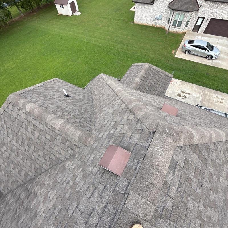 Asphalt shingle roof with ridge vents and flashing installation