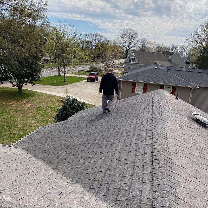 Asphalt shingle roof inspection with hail damage assessment