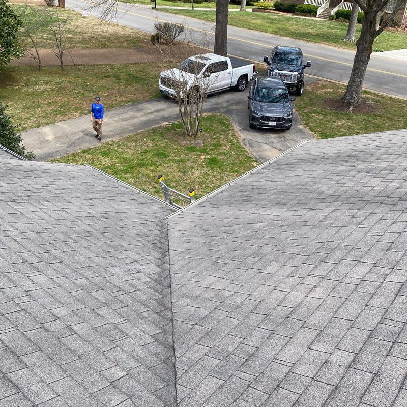 Asphalt shingle roof with valley ridge and ladder