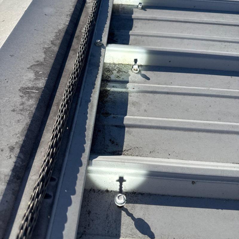 Metal roof panel fasteners with rust and debris buildup