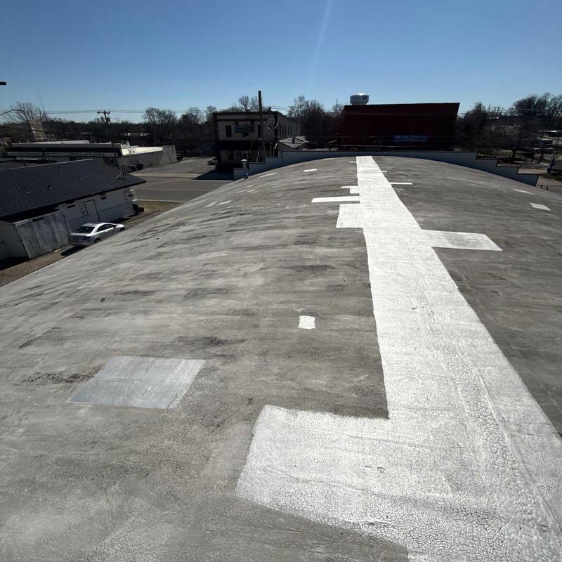 Flat roof membrane with white seam patches