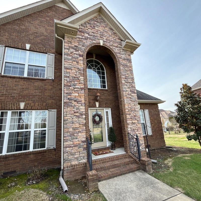 Asphalt shingle roof hail damage with front porch entry