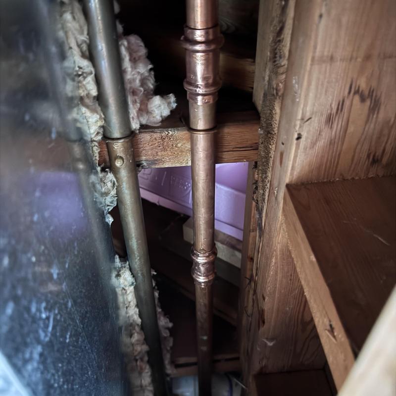 Copper pipe with new fittings inside ceiling cavity