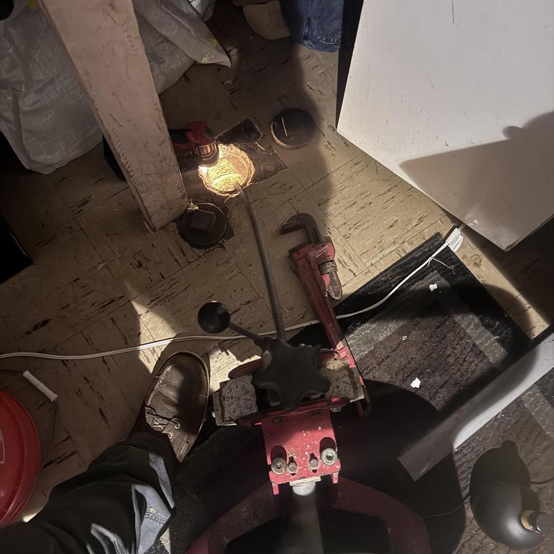 Main sewer cleanout with drain snake and wrench