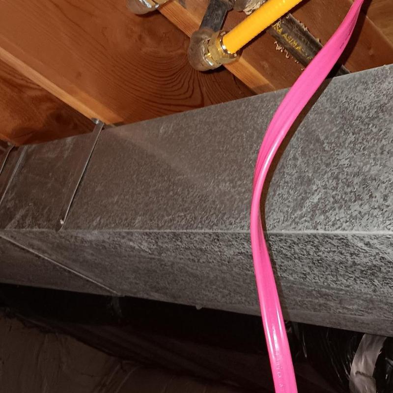 Gas line connection near water line and shower spout