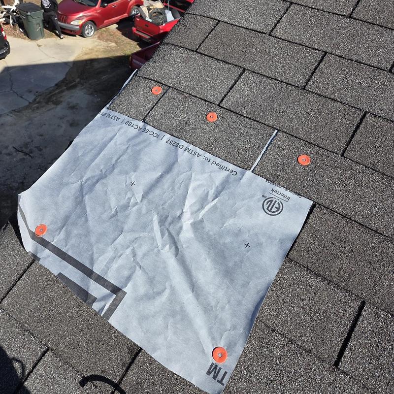 Roof underlayment patch with fasteners on shingle roof