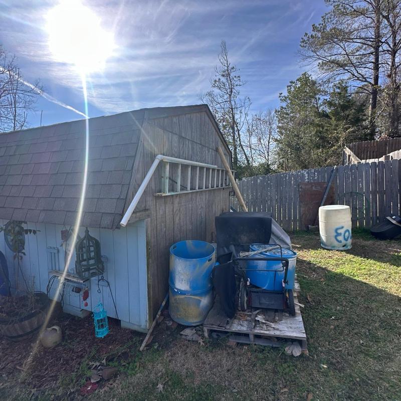 Shed roof and exterior wall inspection with ladder Shed roof and exterior wall inspection with ladder