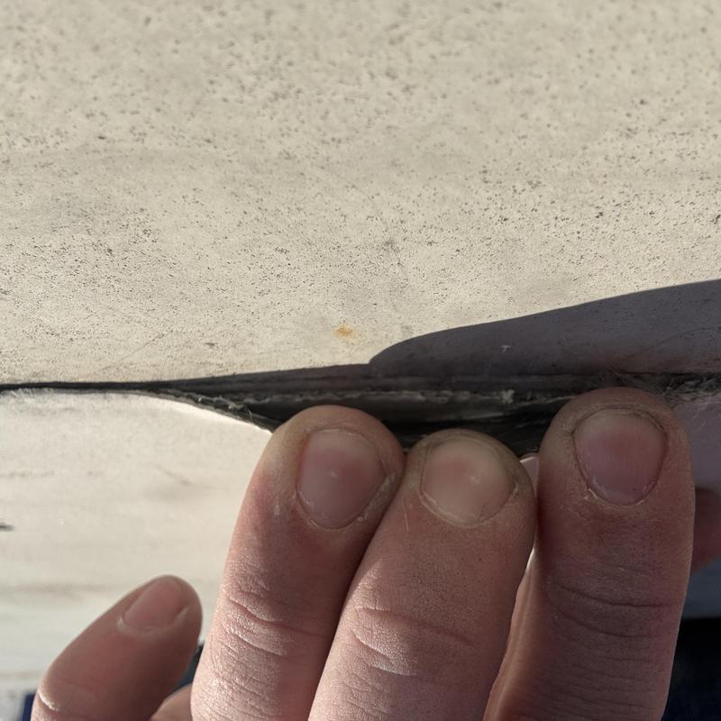 TPO roof membrane separation during inspection TPO roof membrane separation during inspection