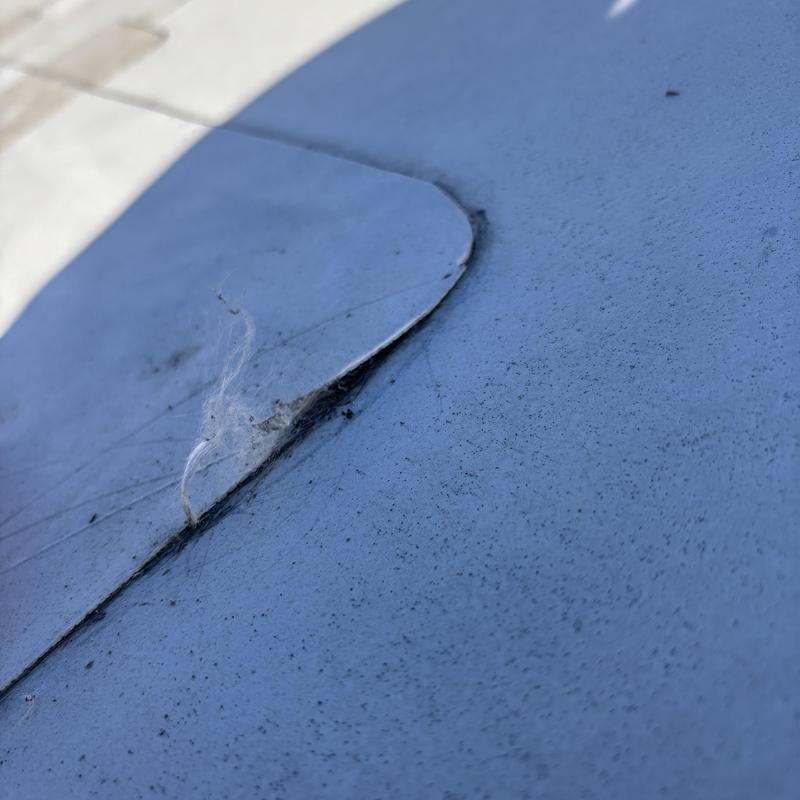 TPO roofing membrane edge lifting on commercial roof TPO roofing membrane edge lifting on commercial roof