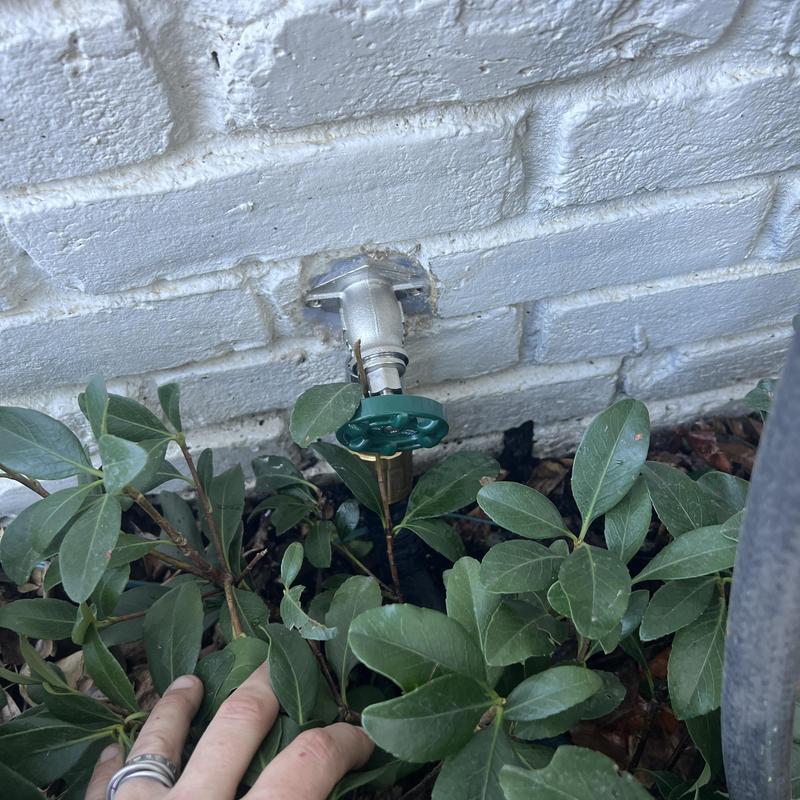 Frost free hose bib with seal on brick wall