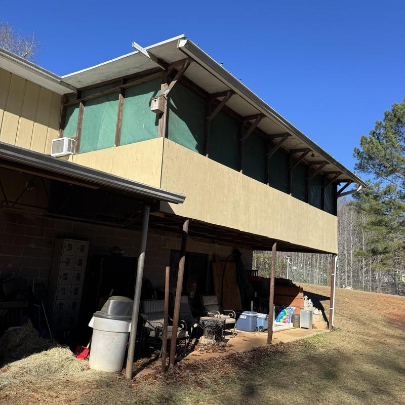 Roof overhang and gutter inspection on residential building