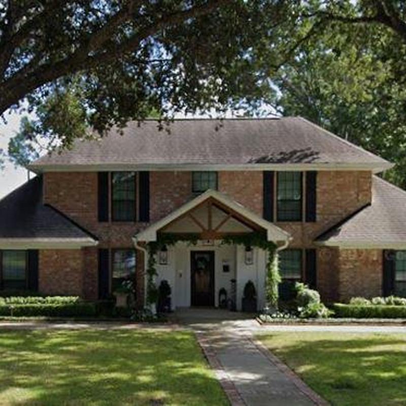 Asphalt shingle roof on two-story brick house Asphalt shingle roof on two-story brick house